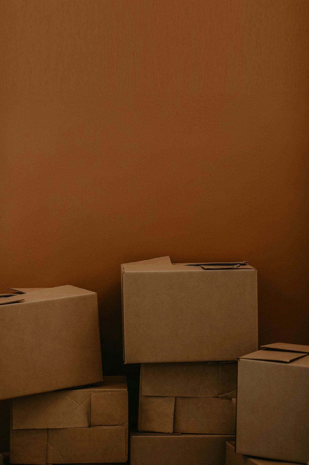 Stacked cardboard boxes ready for collection in Chichester